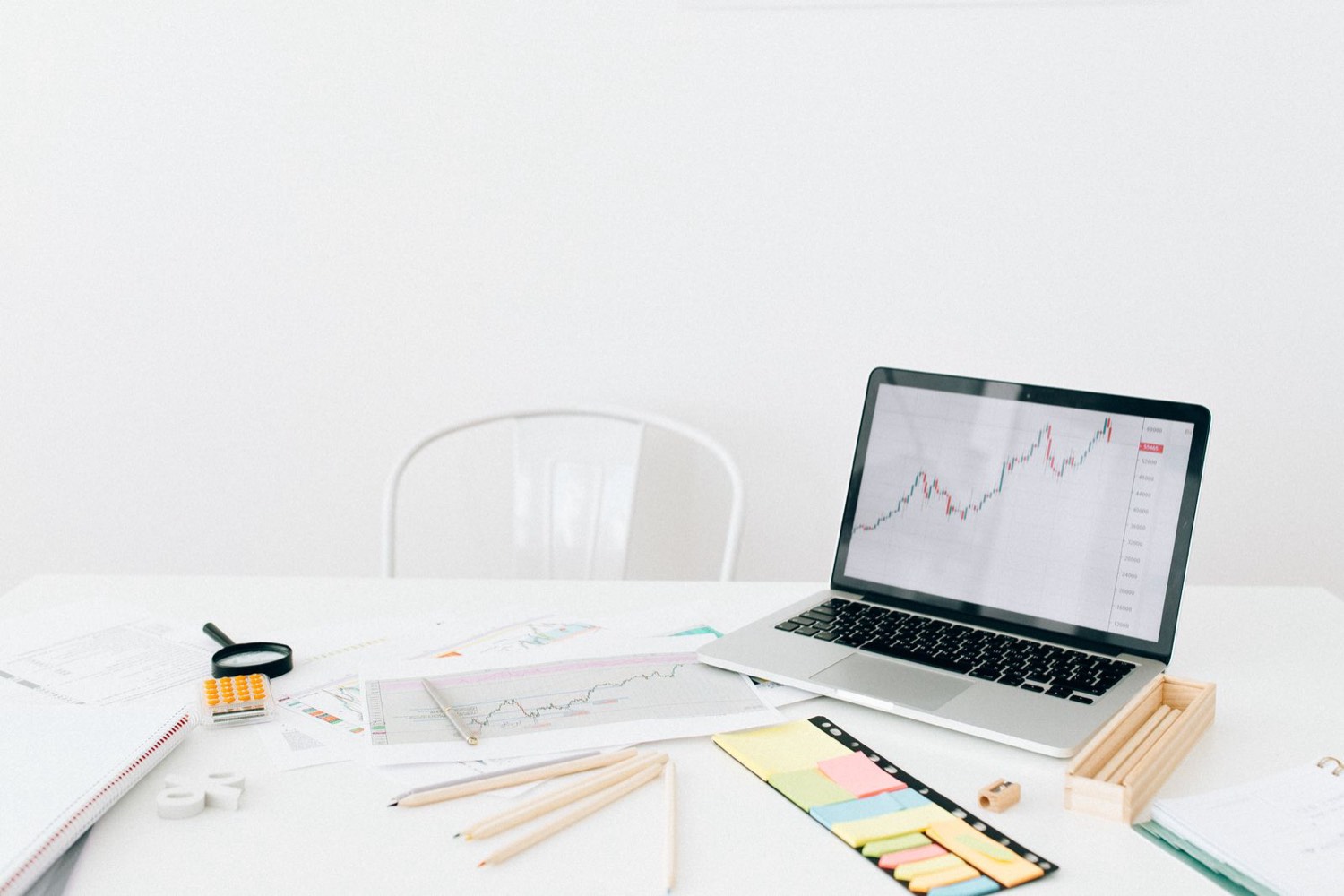 Laptop showing charts on a desk