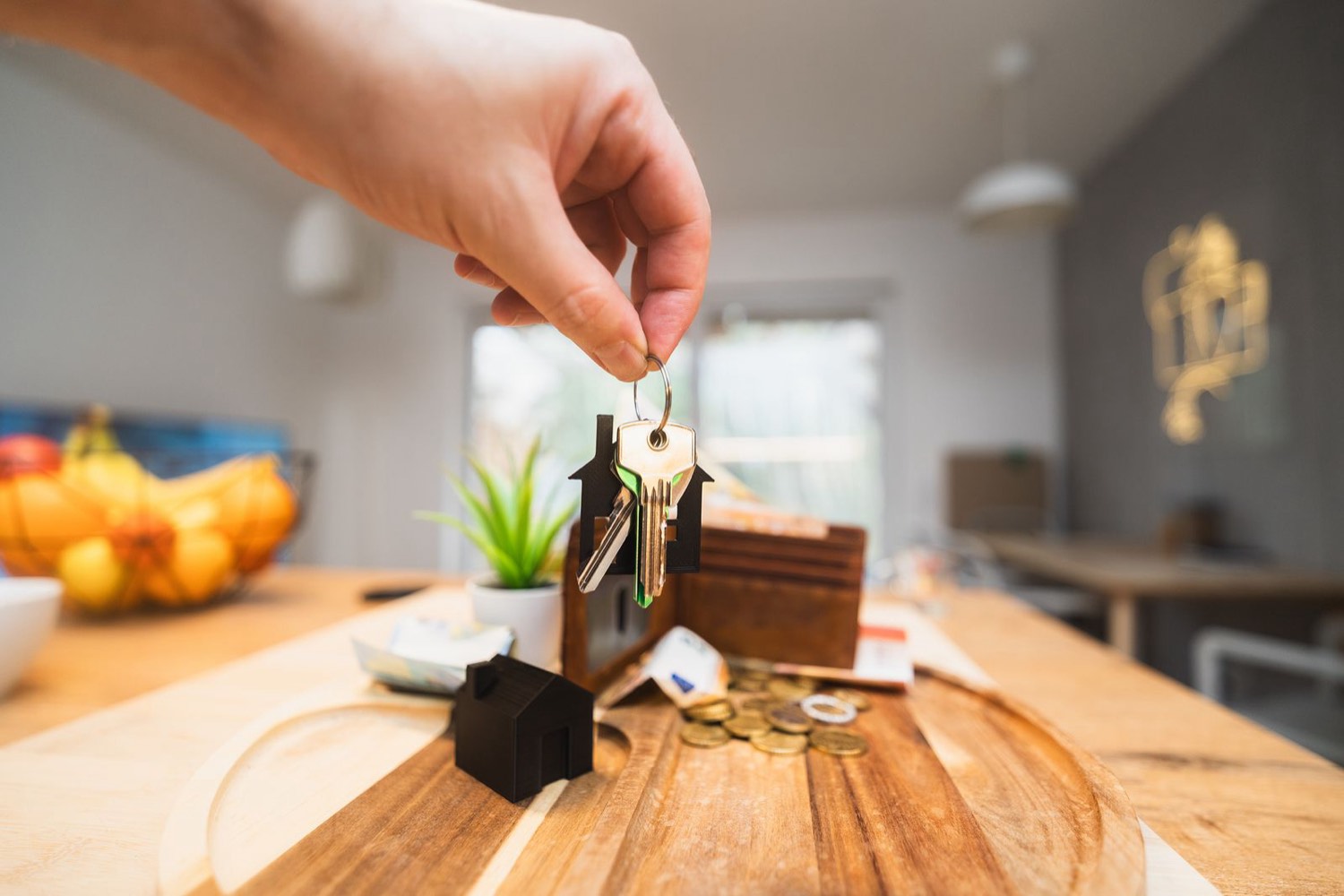 House keys handed over in a living room